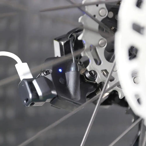 Type C To 4 Pin Rear Derailleur Charger Converter For 12 Speed DI2 Systems in use on a bicycle, showing charging connection.