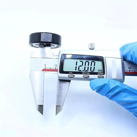 Digital caliper measuring 12.00mm for precision is shown, ideal for Top Shelf Tough As Nails High Temperature Bearing Repair Kit 6201ZZ.