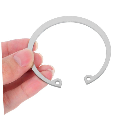 Close-up of hand holding Stainless Steel C Clip Retaining Ring Set Five Pieces Durable Grooved Shafts With Elastic Design For Easy Install