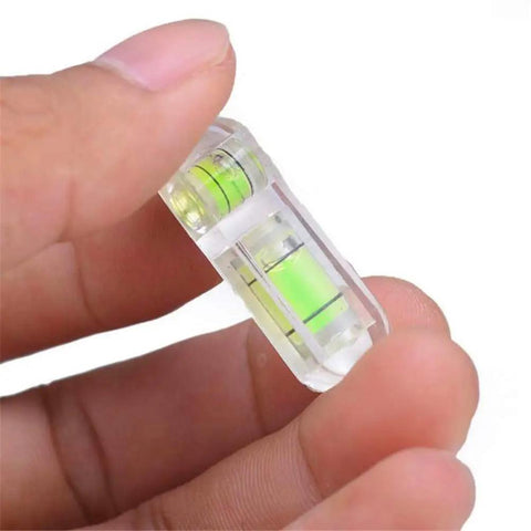 Tiny But Mighty 3 Pack Mini Bubble Spirit Levels, acrylic pocket level in hand, accurate and compact for tight spaces.
