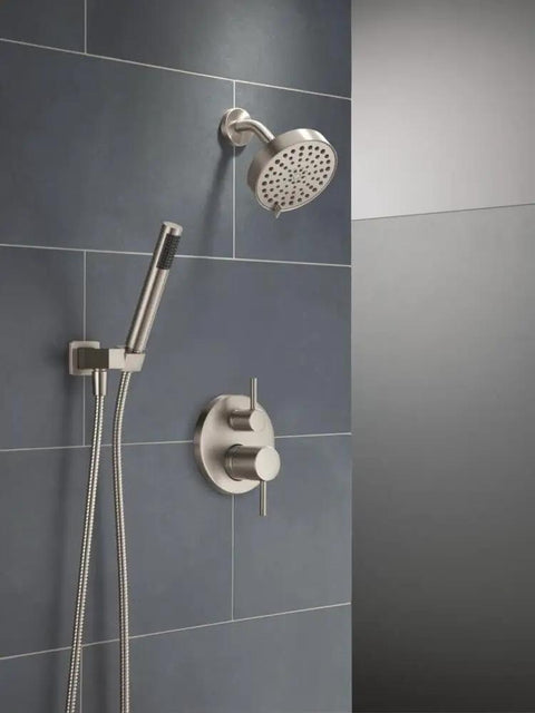 Slick Brushed Nickel Shower System Valve Trim Kit Featuring A Badass 6 Inch Rainfall Head and wall mount handheld against a tiled wall.