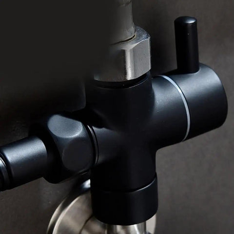 Super Tough 3 Way Shower Diverter Valve With Solid Brass Build And Seamless 1 Inlet To 2 Outlet Switching Featuring No Sweat Removable Nut Setup Plus Dependable Rubber Gaskets That Stay Leak Free And Make Bathroom Upgrades A Breeze For Everyone close-up of black brass shower diverter valve with integrated rubber gasket.