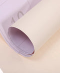 Top Shelf Beige Peel And Stick Waterproof PVC Wallpaper For Walls And Cabinets rolled showing texture and backing details.
