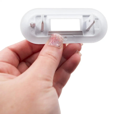 Hand holding white Top Load Washer Lid Lock Bezel Replacement White Bezel 4502680 Model Fits Most Major Brands Easy Install No Fuss Lid Won’t Close Or Lock Durable Plastic Construction