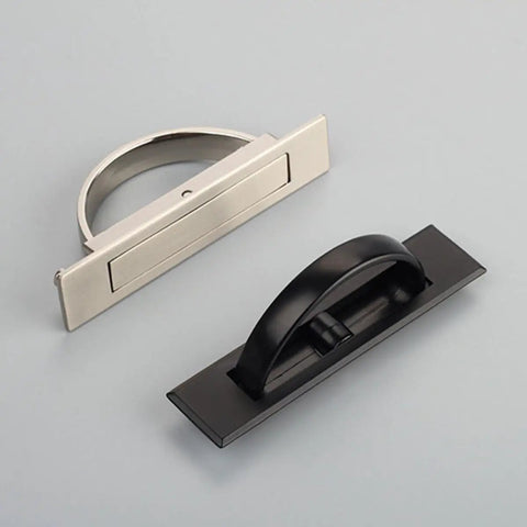 Two zinc alloy cabinet door pull handles with rotatable hidden rings in brushed and black finishes for dressers and wardrobes.