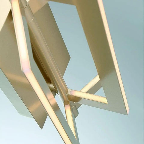 Close-up of the Slick Modern Wall Sconce With Asymmetrical Fan Frame LED Light Featuring Water Mill Inspired Gold Finish.