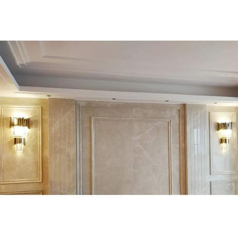 Sleek Led Wall Sconce Textured Crystal Glass Rod Shade Brushed Steel Frame illuminating a hallway with warm light.