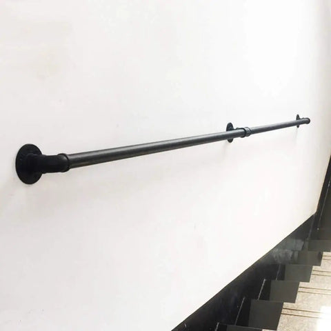 Rustic Industrial Pipe Rail And Durable Wrought Iron Stair Railing For Safe Indoor Outdoor Wall Guard Banister On Porches Decks With A Badass Heavy Duty Build That Is Straight Up Top Notch Quality mounted on a wall.