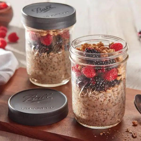 Awesome Leak Proof Plastic Lids for Wide Mouth Mason Jars filled with oatmeal and berries, BPA Free Made In USA
