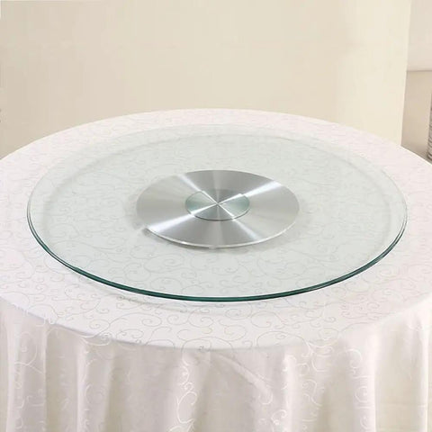 Heavy Duty 43 Inch Lazy Susan Turntable Crafted From Ultra Thick Tempered Glass With Rock Solid Aluminum Base on a dining table.