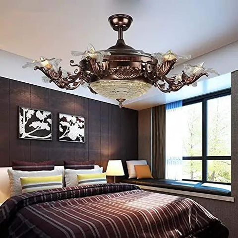 Invisible Retractable Ceiling Fan With Adjustable Dual Tone LED Lighting Plus Hassle Free Remote Control For Ultra Quiet Living Room Kitchen Vibe Upgrade in decorative bronze finish above a stylish bedroom.