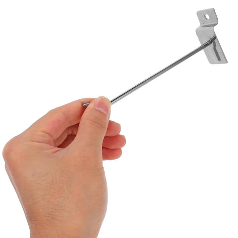 Hand holding single Slatwall Hook For Phone Accessories, Heavy Duty 50 Pack Iron Pegboard Display Hanger for easy setup