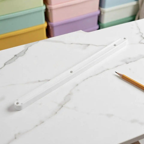 Top Shelf White Plastic Cabinet Drawer Slides Six Pack Side Mount Runners on marble surface with a pencil.
