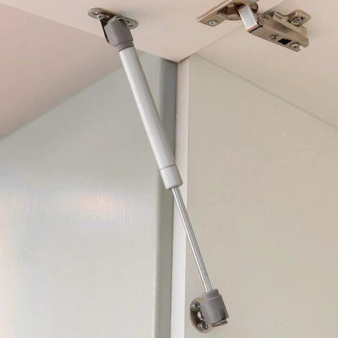 10 Pack Top Shelf Gas Struts 100N Hydraulic Springs Built Tough Deliver Smooth 10 Inch Lift Pneumatic Support attached to cabinet.