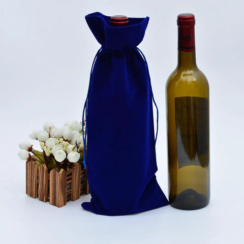 Four Pack Flannelette Wine Bottle Bags With Drawstrings For Travel Gift Packaging And Party Supplies Fabric Bottle Covers next to bottle