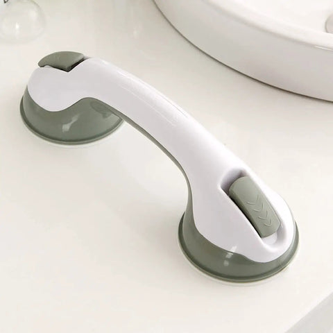 Green and white suction grab bar on bathroom counter.