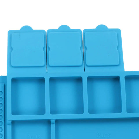 Close-up of blue Pro Grade Silicone Electronic Repair Mat With High Temperature Resistance Antistatic Soldering Pad, showing slots.
