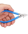 Hand holding Beefy Diagonal Wire Cutter Pliers With Rebound Spring for easy one hand cuts, precision sharp edges for electricians and DIY enthusiasts.
