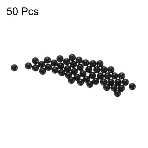 Front view of 50 black silicon nitride ceramic bearing balls, 2 mm.