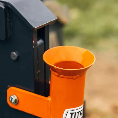 Close-up of orange 2.75 inch tube on Pipe Layer Attachment For Bolt On Single Tine Subsoiler for easy install drainage.