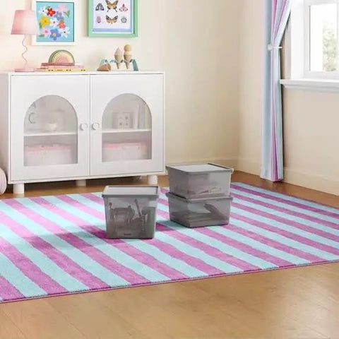 Straight Up Essential Stackable Medium Storage Bins With Secure Lids Hella Neat Gray Plastic Organizer Box For Clothes And Toys in a child's room.