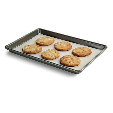 Freshly baked cookies on a baking sheet lined with Premium Parchment Paper Roll 90 Square Feet Nonstick Baking Liners 15 Inches Wide Oven Safe Up To 425 Degrees For Sheet Pans No Fuss Magic For Your Daily Grind And Weekend Feast Prep.