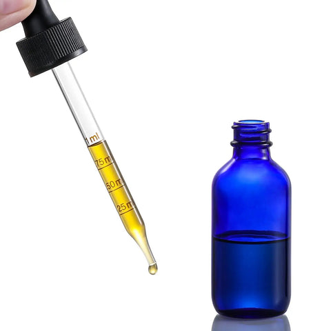 Dead Simple 2 Oz Dark Blue Glass Dropper Bottles, 4 Pack With Exact 1Ml Calibrated Eyedroppers, No Drama Silicone Caps For Essential Oils, showing dropper next to bottle.