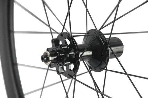 Close-up of Carbon Disc Wheelset 50C-25 Clincher Road Wheels UD Matte Finish Six Bolt hub detail.