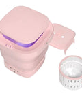 Hella Compact Portable Washer And Dryer Combo Slick Foldable Mini Washing Machine With Smart Touchscreen shown in pink with lid and basket.