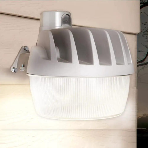Energy Star LED dusk to dawn light with aluminum exterior, mounted on wall, ultra bright and weatherproof for outdoor use.