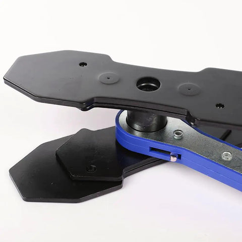 Close-up of 360 Degree Brake Caliper Press Tool With Two Sets Of Steel Plates And Blue Ratchet Piston Spreader for car disc brakes.