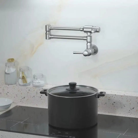 Pro Grade Stainless Steel Pot Filler Faucet For Wall Mount Kitchen Sink next to stove, folded away, in a modern kitchen setting.