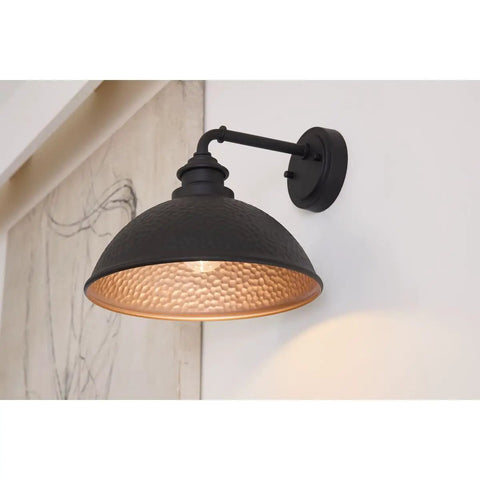 Englewood Collection 1 Light Farmhouse Outdoor Wall Lantern in Textured Black on exterior wall, copper interior visible.