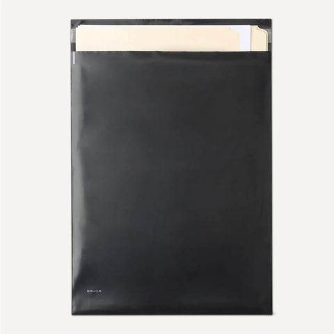 Tackle All Your Shipping Needs With These Badass Poly Mailers And Shipping Bags Featuring Lock Down Self Sealing Tapes Tamper Resistant Waterproof Design Perfect For Hustling Online Orders In 10x13 Black 100 Count Bulk, showing a black 10x13 poly mailer with documents inside.