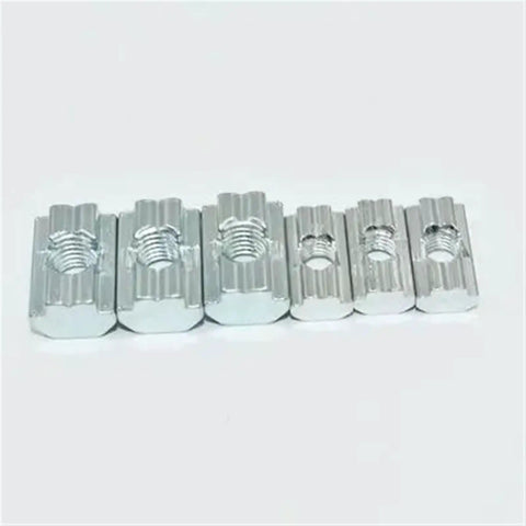 Get These Awesome Sliding T Nuts For 20 Series Aluminum Profiles! M3, M4, M5, And M6 Hammer Drop Fasteners Are Built Durable And Rust Proof. Perfect For DIY Workbenches, Industrial Racks, Or Home Workshops Where You Need Serious Strength Without The. Image shows six metal T-nuts in various sizes for M3 to M6, featuring a rust-proof finish.