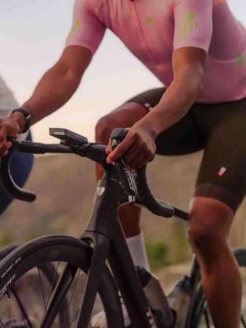 Cyclist using Force ETap AXS Left Shift and Brake Lever Exchange Kit with Carbon Lever Blade on a road bike