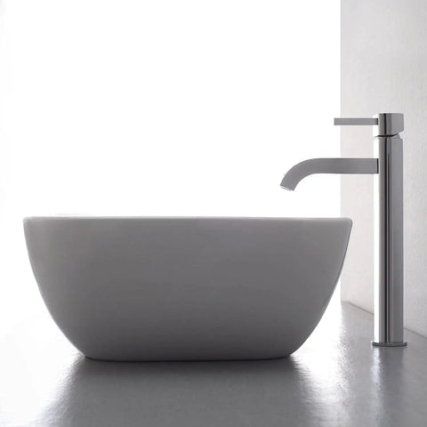 Ramus Single Handle Vessel Sink Bathroom Faucet Chrome Finish For A Slick Modern Bath next to a white vessel sink on countertop