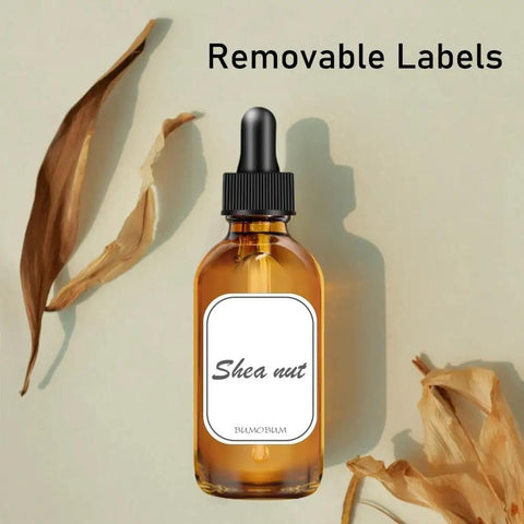 Two Pack Real Deal Amber Glass Dropper Bottles Two Oz With Straightforward Graduated Markings And No Fuss Silicone Caps To Keep Your Favorite Essential Oils Protected From Harsh Sunlight on a light background.