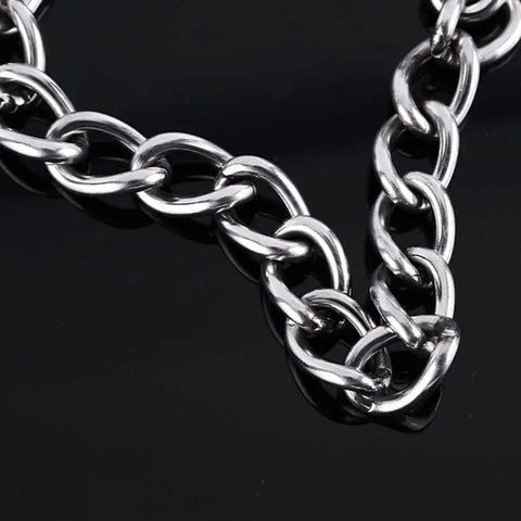 Real Deal Stainless Steel Door Security Chain With Deadbolt Stops close-up view of durable chain links on a black background.