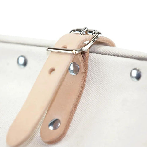Close-up of secure buckle straps on Heavy Duty Natural Canvas Tool Bag With Wide Hinged Opening and riveted construction.
