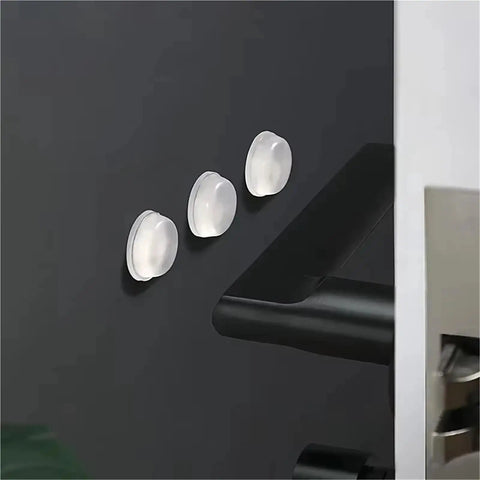 Bulk 1000 Pack Silicone No Slip Pads For Drawers And Cabinets on a cabinet door, soft rubber feet in 10x2mm size shown.