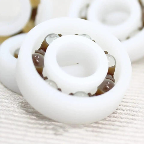 Premium Pom Plastic Ball Bearings 5 Piece Kit close-up of white bearing showcasing self dry lubricant and robust design.