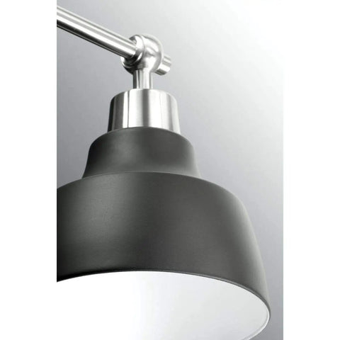 Close-up of Bramlett Brushed Nickel Two Light Bath And Vanity Fixture With Matte Black Shades And Back Plate