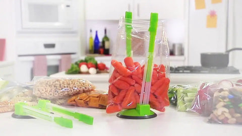 Upgrade Your Kitchen Grind With This Adjustable Ziplock Bag Holder Stand Featuring A Nonslip Base For Effortless Freezer Storage, holding carrots.