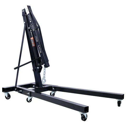 Heavy Duty 2 Ton Hydraulic Engine Hoist Folding Cherry Picker with six slick iron casters in a folded position.