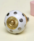 Top Shelf Ceramic Silver Dot Drawer Knobs 100 Piece Set With Sleek Modern Cabinet Pulls For Kitchen Cabinets And Dressers Easy Install Rust Proof Hardware. White ceramic knob with gold accents and silver dots.