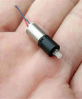Ultra Tiny 6mm DC 3V Mini Planetary Gear Motor With 1 To 26 Gearbox 1200 RPM Coreless Drive for DIY robots shown on hand
