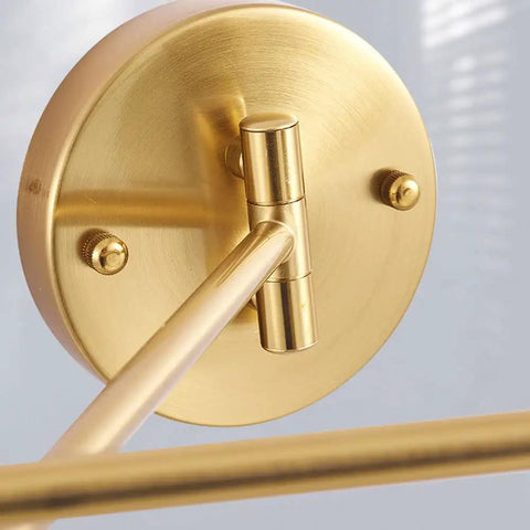 Close-up of Badass Industrial Metal Swing Arm Wall Sconce With Rock Solid Adjustable Dome Shade and E27 Socket in brass finish.