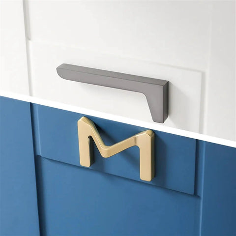 Dope Brushed Gold Cabinet Handles 64mm Drawer Pulls For Wardrobes And Furniture shown on a blue drawer.