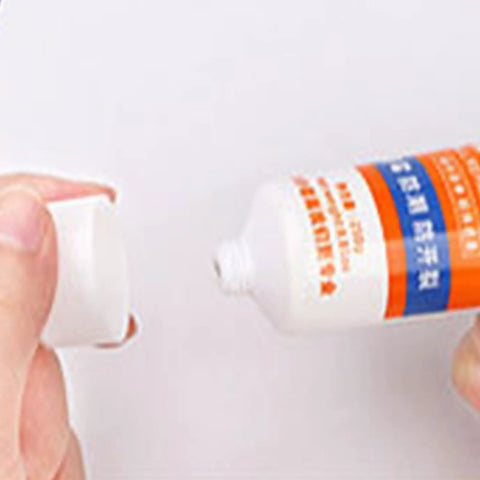 Close-up of a tube being opened, containing Wall Repair Paste Quick Drying Crack Fix Kit Drywall Filler for home and office use.